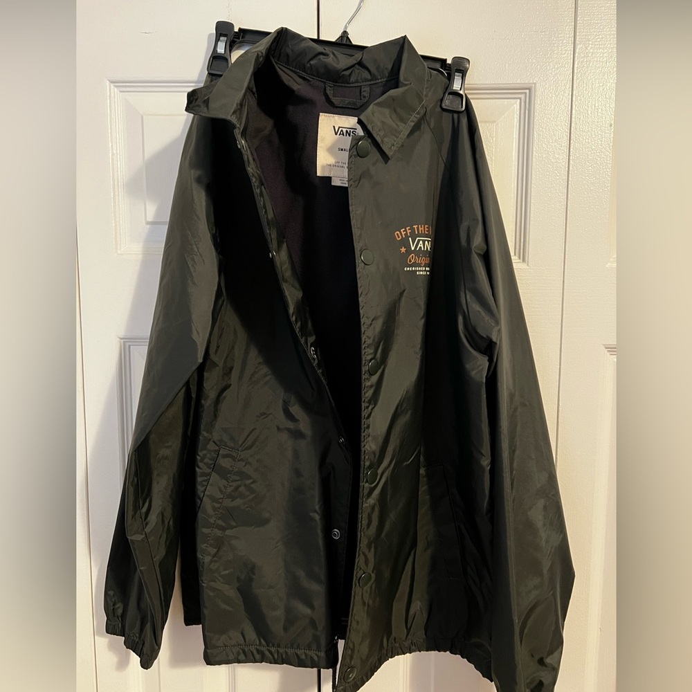 Vans windbreaker, size small, forest green with small logo on chest.